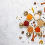 Assorted spices on light background.Curry, paprika, pepper,coria